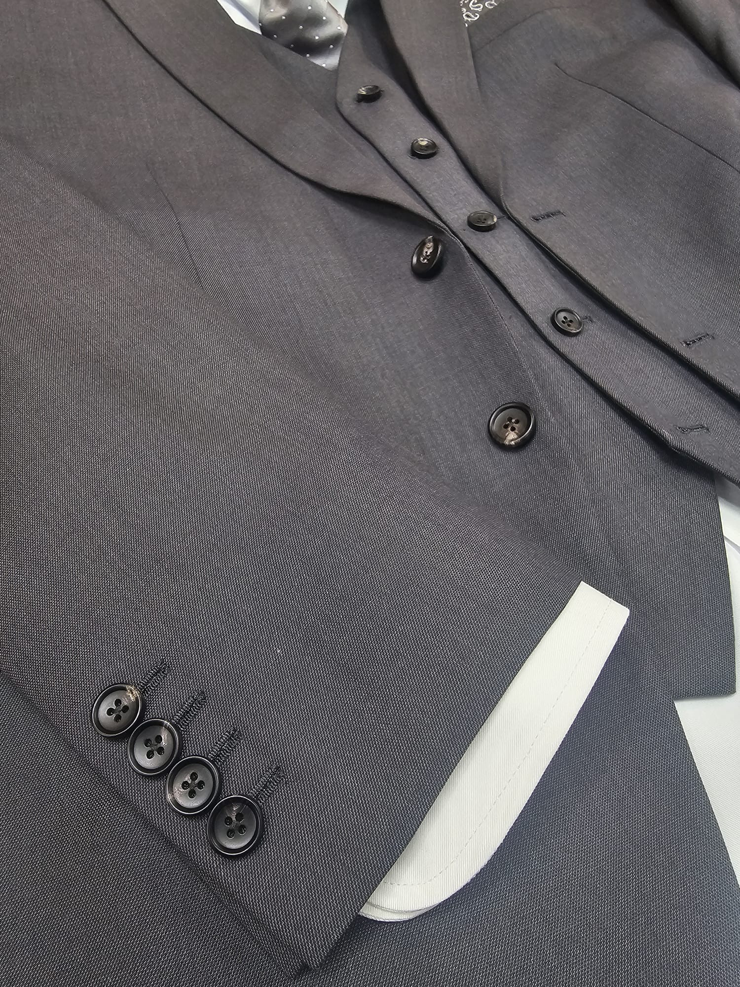 Grey suit button detail